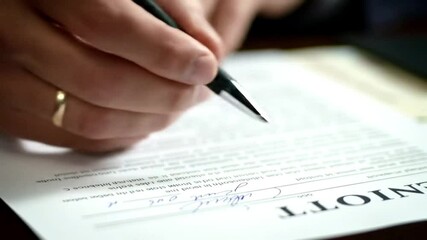 Businessman signing a contract, signature, Close up of a businessman's hands signing a contract.