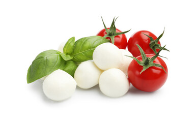 Tasty mozzarella cheese balls, tomatoes and basil isolated on white