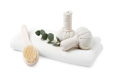 Clean waffle towel, massage bags, brush and eucalyptus isolated on white