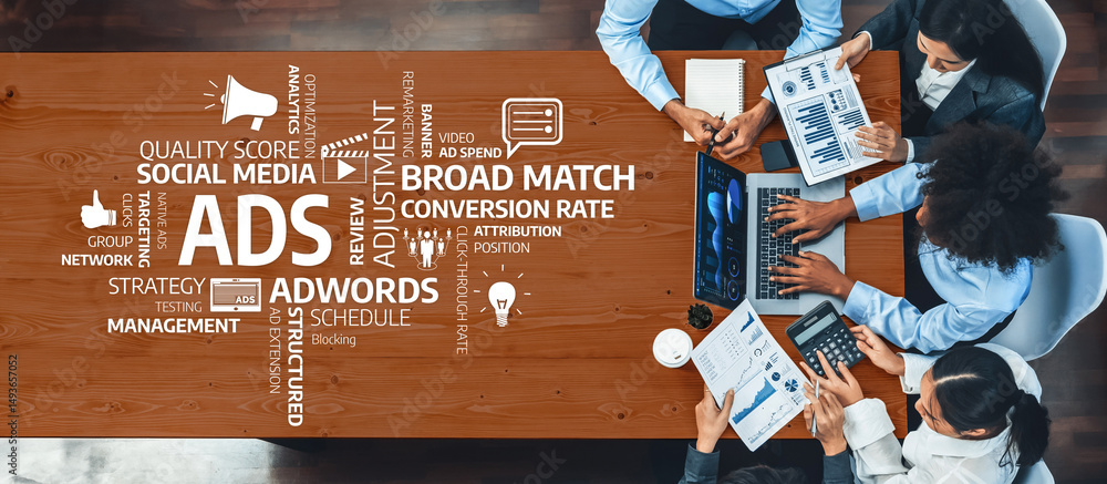 Poster a dynamic business meeting showcasing a group analyzing digital marketing strategies with laptops an