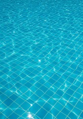 Obraz premium Sparkling Blue Pool Water Texture - Close-up of a swimming pool's surface, showing clear blue water with gentle ripples reflecting sunlight