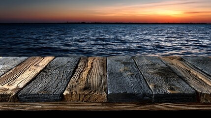 Serene ocean view, weathered wooden deck overlooking calm waves at sunset, perfect for relaxation or inspirational quotes.