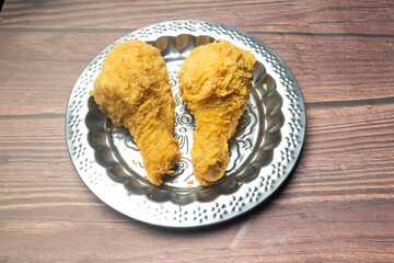 Crispy Chicken Fry served in plate isolated on wooden background top view of Bangladeshi food