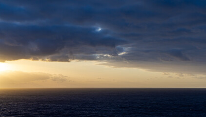 Dramatic Cloudscape Over the Pacific Ocean at Sunset Horizon
