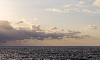 Serene Ocean Horizon with Clouds During Sunset in the Pacific Ocean