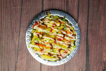 BBQ Chicken pasta served in plate isolated on wooden background top view of Bangladeshi food