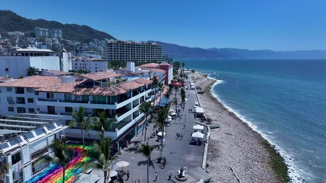 Aerial Mexico Puerto Vallarta Malecon shore 4 4K. Mexican beach resort city on Pacific Ocean. International tourist destination. Tourism is the economic activity. Outdoor recreation. Vacation.