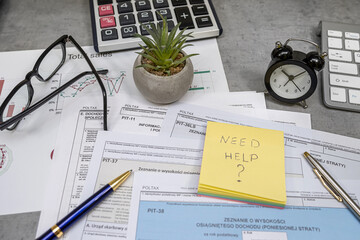 Text Need help on sticker Annual tax polish tax forms PIT-36 PIT-37 PIT-38 with pen calculator.