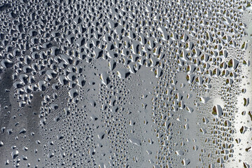 background, unusual, abstract. drops of morning dew, condensation on the glass. wet glass. water...