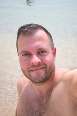 close up portrait of midage man on the beach
