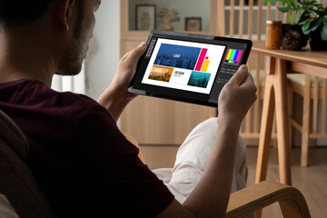 Graphic designer software for modern design of web page and commercial ads showing on the computer screen