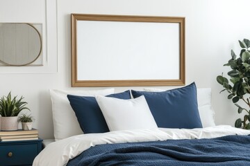 Navy blue and white bedroom with framed art