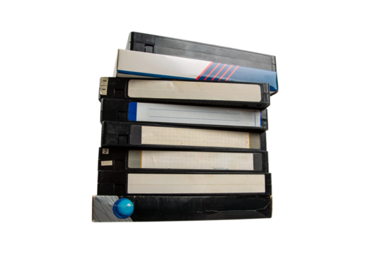 Stack of old VHS tapes with blank labels, isolated on transparent background.