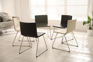 Chairs in circle prepared for group psychotherapy session indoors