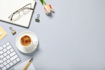 Flat lay composition with stationery, flower and coffee on light grey background. Space for text