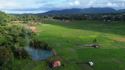 Aerial View of Sulphur Thermal Lakes for Swimming in Ranolewo, Tomohon – Volcanic Landscape and Rice Fields in North Sulawesi, Indonesia..