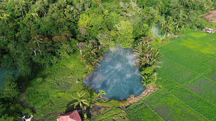 Aerial View of Sulphur Thermal Lakes for Swimming in Ranolewo, Tomohon – Volcanic Landscape and Rice Fields in North Sulawesi, Indonesia..