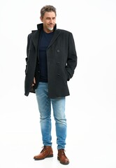 Middle age casual man in coat and jeans. Mid adult, mature age, happy smiling. Full length portrait isolated on white.