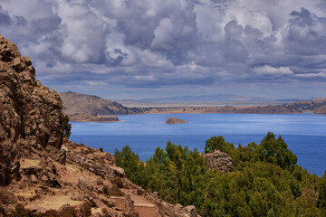 Fototapeta premium From the heights of Amantaní Island, Lake Titicaca stretches endlessly—its deep blue waters reflecting the sky and the spirit of the Andes.