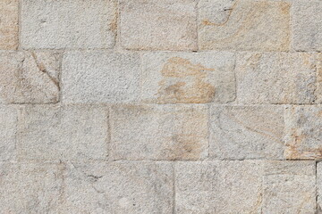 Textured stone wall displays natural history and rugged beauty
