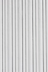 Vertical lines of painted wooden background create a serene backdrop in neutral tones