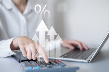 Businessman person using calculator finance chart graph investment document in office data laptop tax budget concept