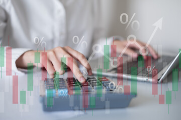 Businessman person using calculator finance chart graph investment document in office data laptop tax budget concept