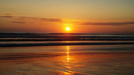 Obraz premium Beautiful sunset over a serene beach with gentle waves and colorful sky at dusk