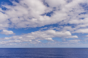 Cloudscape Over the Blue Pacific Ocean Underneath a Vibrant Sky
