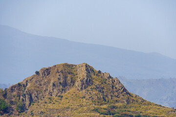 Fototapeta premium Typical hill in the rural sicilian hinterland near Taormina on Sicily, Italy 
