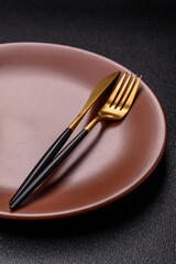 Empty plate with utensils as a conceptual background for lunch, breakfast, meal