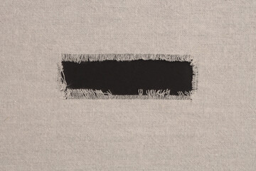 Grunge beige canvas denim fabric torn frame. Texture abstract background.