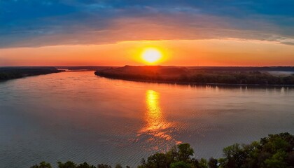 Obraz premium sunset over the mississippi river near portage des sioux missouri