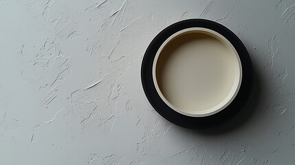 Cream-colored circle on textured background