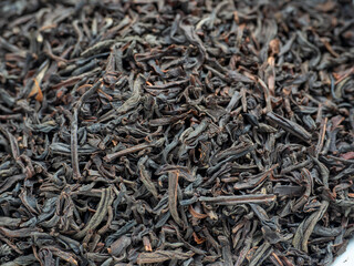 Close-up of red tea leaves from China. Macro photo, top view, flat lay. Tea drinking tradition, food background