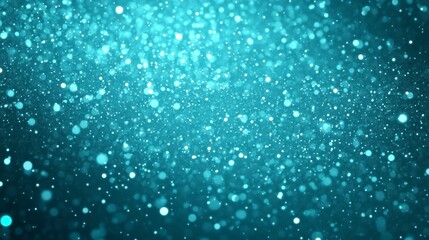 Obraz premium Abstract teal bokeh background with glowing particles and glitter.