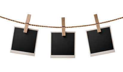 Three Blank Polaroid Photos Hanging on a Twisted Rope with Wooden Clothespins, Perfect for Display and Decoration, Isolated on Transparent and White Background
