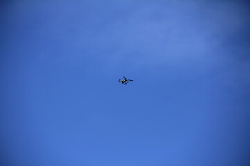 a small drone in low flight above
