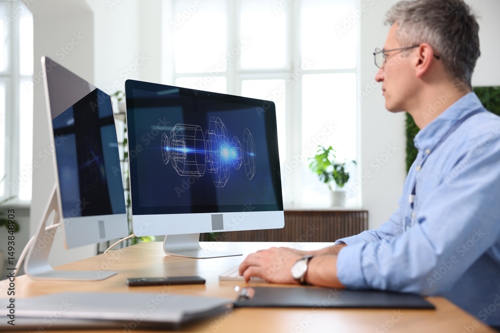 Poster engineer working with digital drawing at table in office