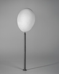 Egg Balanced on a Nail Point