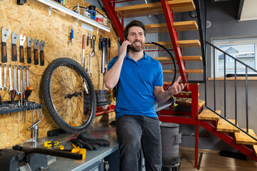 Mechanic talking on phone in workshop