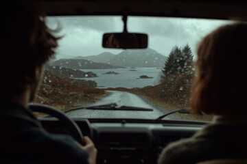 Couple on a scenic road trip through the Scottish Highlands