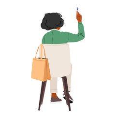 Adult businesswoman cartoon character holding raised hand with pen sitting on chair backside view