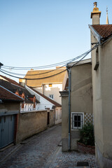 Narrow streets and old houses in grand cru champagne village Ay-Champagne in Marne river valley, France