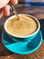 Latte art in blue cup Coffee cup