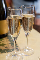 Pouring and tasting of dry sparkling wine brut, grand reserve, champagne in Ay-Champagne wine making village in Vallee de la Marne, , Champagne region, France