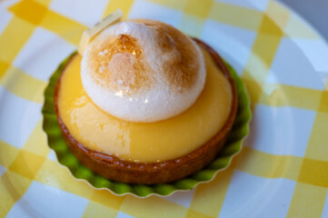 One piece of lemon tart with white eggs meringue from French pastry shop