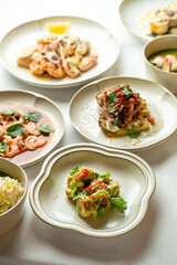 Delightful dishes showcase a variety of flavors and ingredients, beautifully presented on elegant plates. A picturesque dining experience awaits guests at this upscale venue