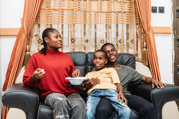 Happy Family Sitting Together on a Couch Sharing Quality Time