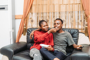 Couple Enjoying a Cozy Moment Together Relaxing in Their Comfortable Home